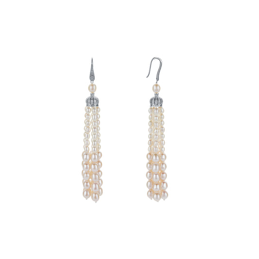Pair of pearl drop earrings on a white background