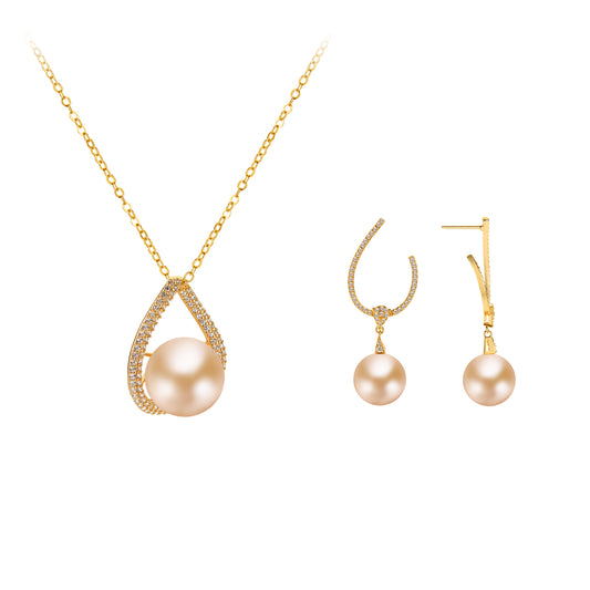 Gold necklace and earrings with pearls on a white background