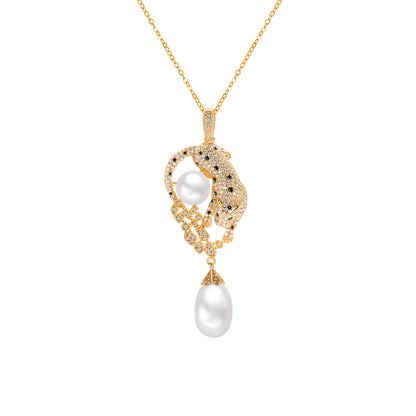 Gold leopard necklace with a pearl pendant on a white background
