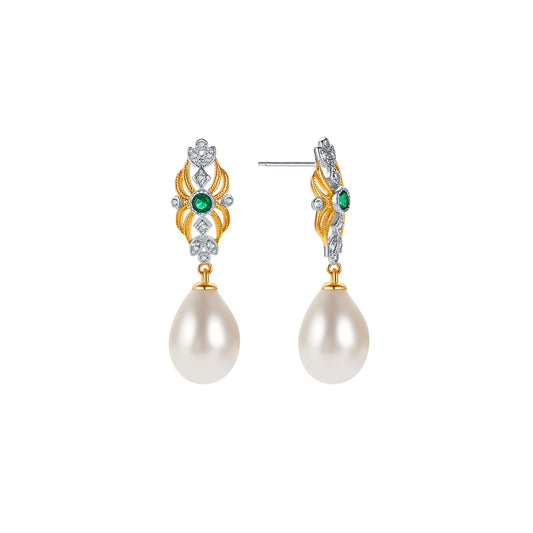 Pair of pearl earrings with gold and gemstone accents on a white background