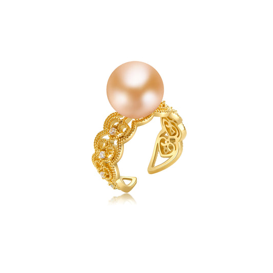 Gold ring with a large pearl on a white background