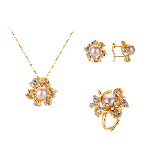 Gold jewelry set with pearls and blue genstone on a white background