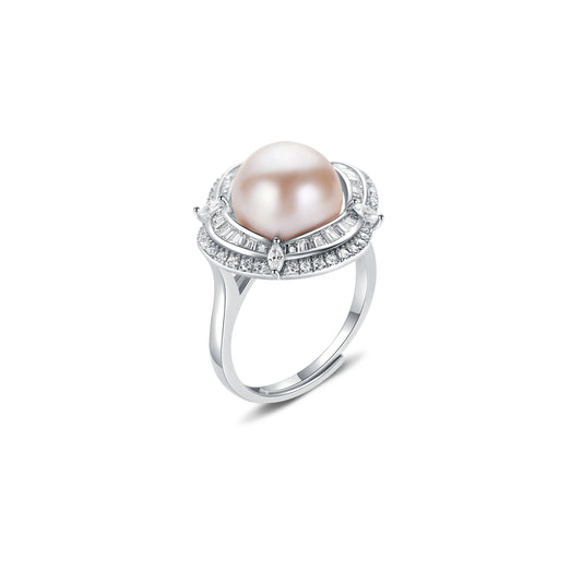 Pearl ring with gemstone accents on a white background