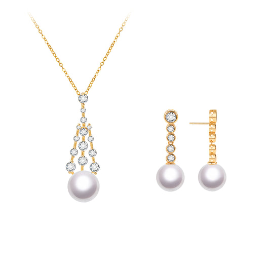 Pearl necklace and earrings set with gold chains on a white background