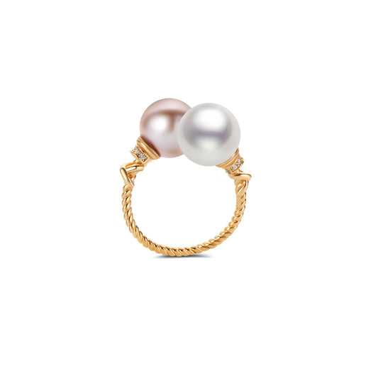 Gold ring with two pearls on a white background