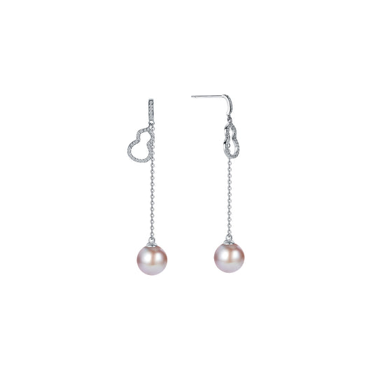 Pair of pearl drop earrings on a white background