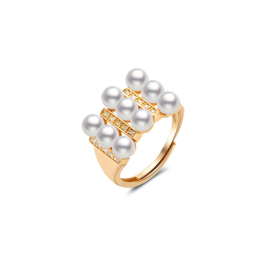 Gold ring with pearls on a white background