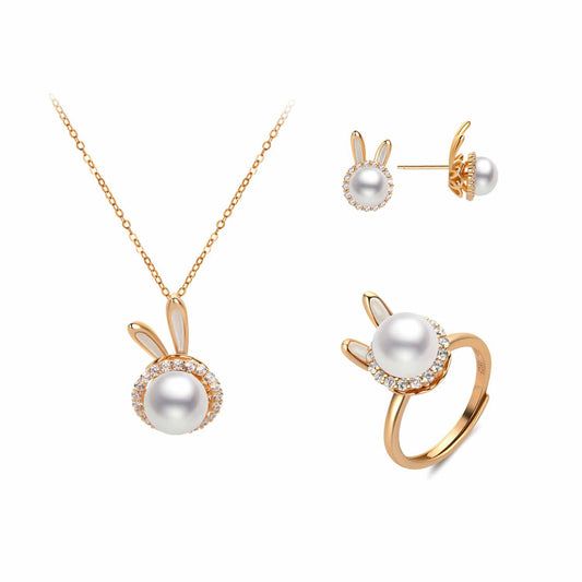 Jewelry set with rabbit-shaped necklace, earrings, and ring on a white background