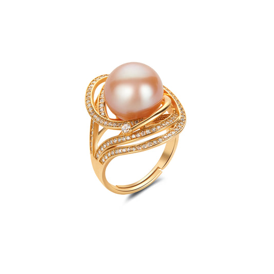 Gold ring with a pink pearl and small gem stones on a white background
