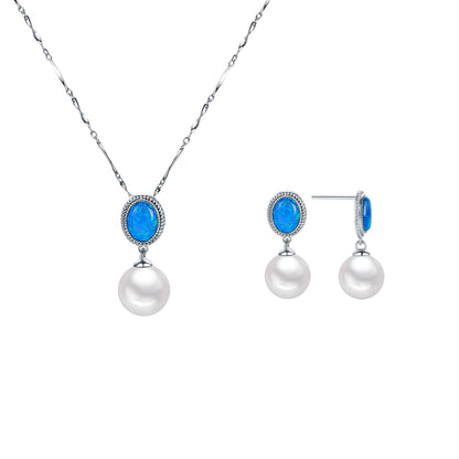 Jewelry set with pearls and blue stones on a white background