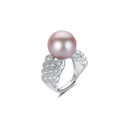 Pearl ring with silver band on a white background