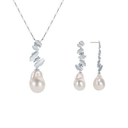 Pearl necklace and earrings set with butterflies accent on a white background