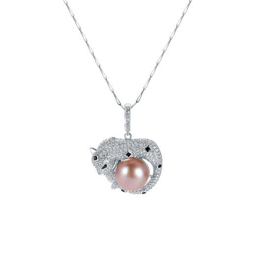 Leopard-shaped pendant with a pink pearl on a white background