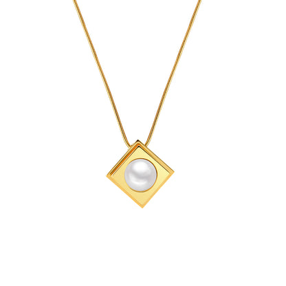 Gold necklace with a square pendant featuring a pearl on a white background